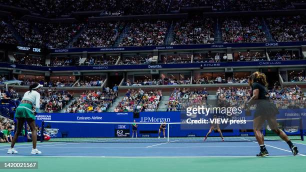 Serena Williams and Venus Williams of the United States returns the ball during their Women's Doubles First Round against Linda Noskova and Lucie...