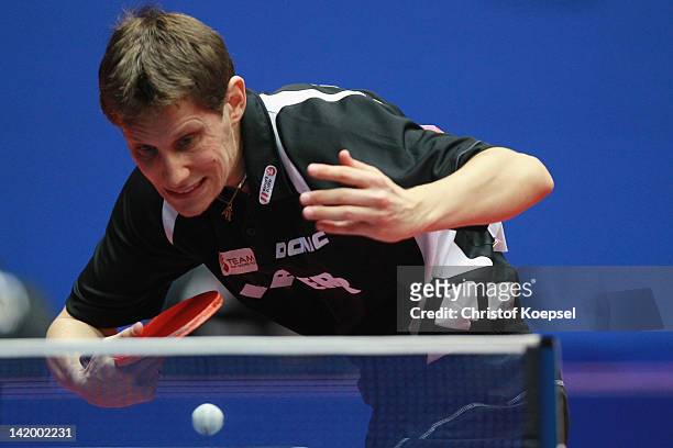 Robert Gardos of Austria serves during his match against Joo Se Hyuk of South Korea during the LIEBHERR table tennis team world cup 2012 championship...