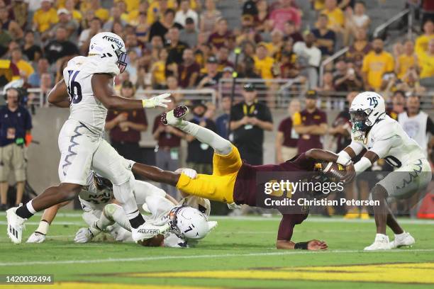 Quarterback Emory Jones of the Arizona State Sun Devils dives short of the end-zone and stopped by defensive back Colby Humphrey of the Northern...