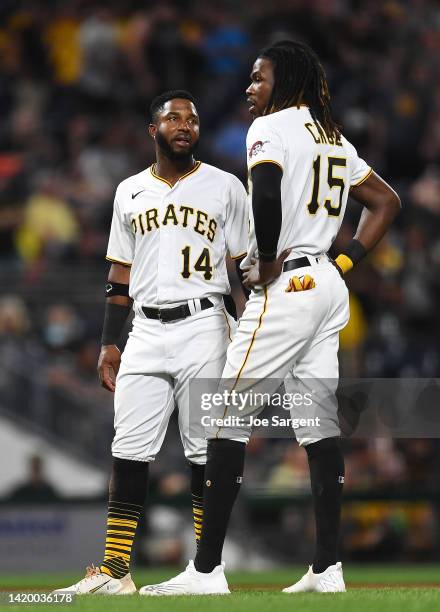 Rodolfo Castro talks with Oneil Cruz of the Pittsburgh Pirates during the game against the Cincinnati Reds at PNC Park on August 19, 2022 in...