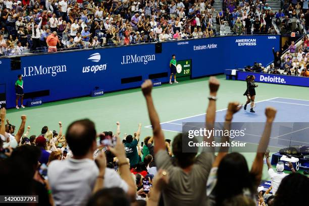 Fans cheer as Serena Williams of the United States celebrates after defeating Anett Kontaveit of Estonia in their Women's Singles Second Round match...