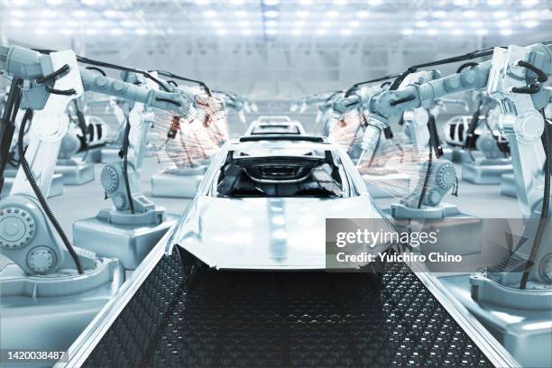 cars on futuristic assembly automotive manufacturing line - car manufacturing fotografías e imágenes de stock