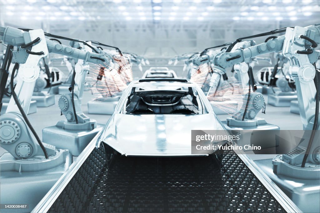 Cars on futuristic assembly automotive manufacturing line