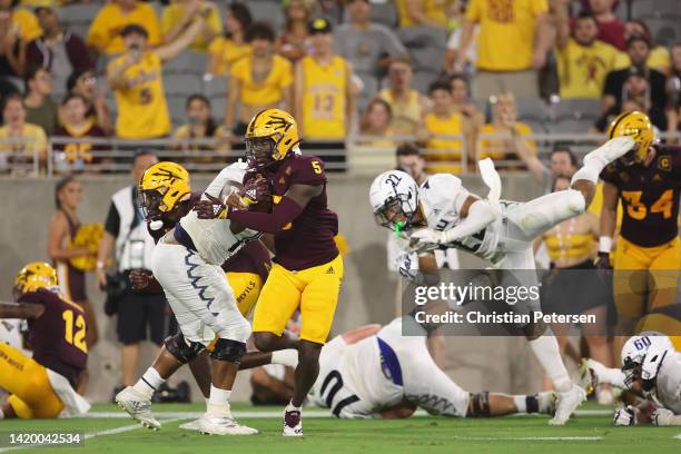 Defensive back Chris Edmonds of the Arizona State Sun Devils runs with the football after an interception against the Northern Arizona Lumberjacks...