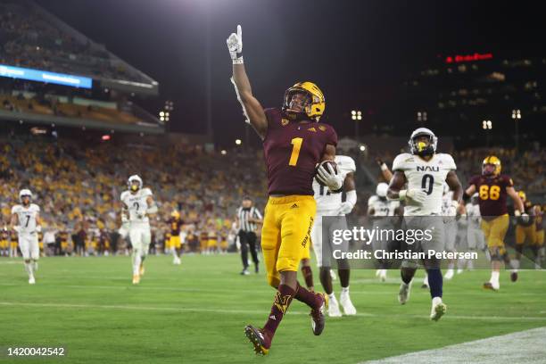 Running back Xazavian Valladay of the Arizona State Sun Devils celebrates after scoring on a 27-yard rushing touchdown against the Northern Arizona...