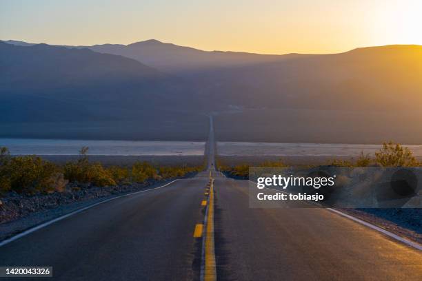 desert highway road - moody sky stock pictures, royalty-free photos & images