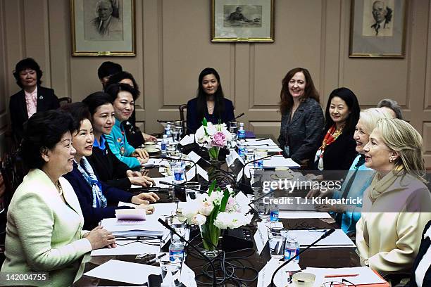 Secretary of State Hillary Clinton sits with Chen Zhili , vice chairperson of the Standing Committee of the Congress of China, at the State...