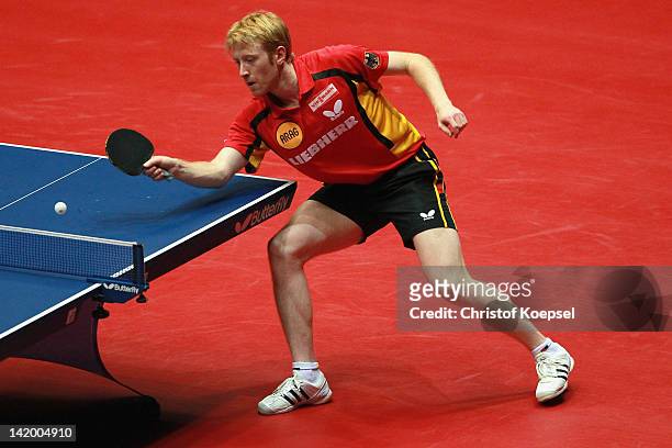 Christian Suess of Germany plays a forehand during his match against Marko Jevtovic of Serbia during the LIEBHERR table tennis team world cup 2012...