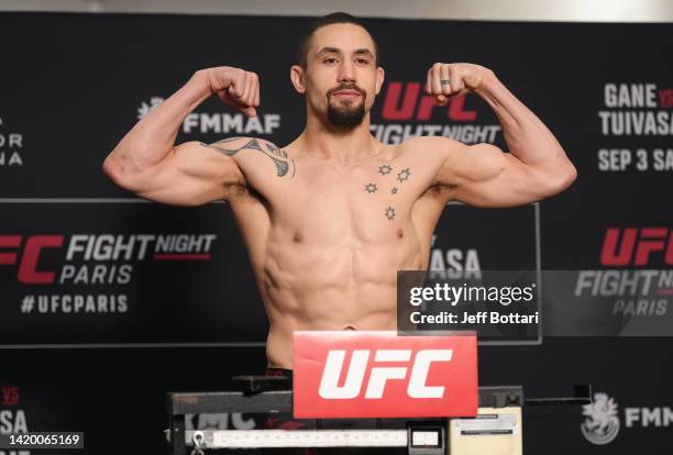 Robert Whittaker of New Zealand poses on the scale during the UFC Fight Night official weigh-in at Pullman Paris Centre Bercy on September 02, 2022...