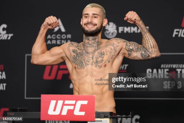 Charles Jourdain of Canada poses on the scale during the UFC Fight Night official weigh-in at Pullman Paris Centre Bercy on September 02, 2022 in...