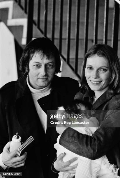 German-American pianist, composer, and conductor Andre Previn and his wife, American actress Mia Farrow who holds their adopted daughter, Lark Previn...