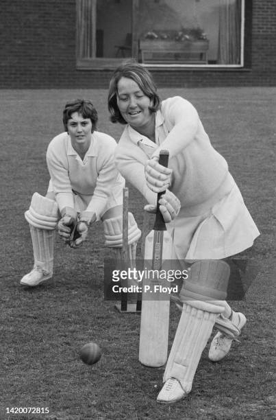 British cricketer Rachael Heyhoe playing a square drive, with an wicket keeper in the background, during a Young England women's cricket team...
