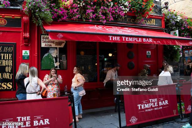 General view of people drinking in front of The Temple Bar on August 18, 2022 in Dublin, Ireland. Dublin is the capital of the Republic of Ireland,...