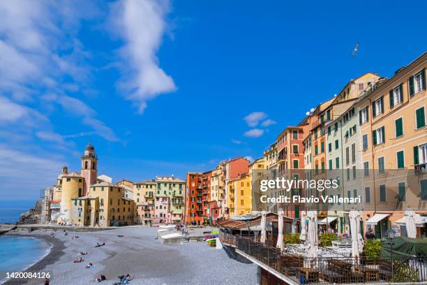 colorful buildings lined up on the camogli promenade - liguria, italy - camogli bildbanksfoton och bilder
