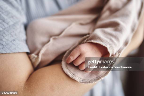 close-up of baby's hand - baby body stock pictures, royalty-free photos & images