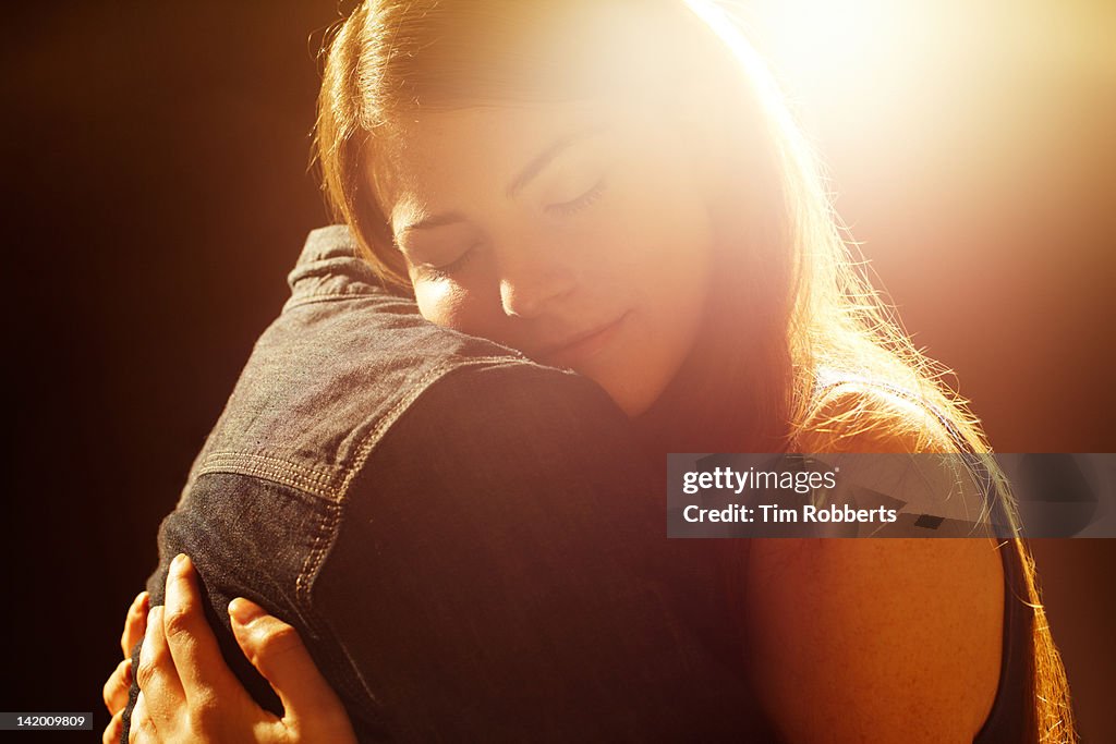 Young couple hugging.