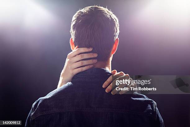 man with womans hands touching his head. - hand touch stock pictures, royalty-free photos & images