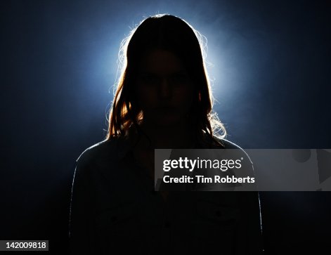 Young woman in silhouette. Young woman in silhouette.