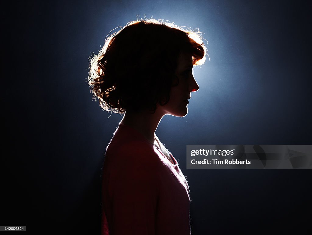 Silhouette of young woman.