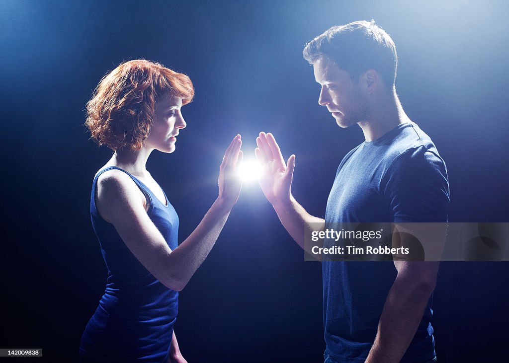 Young couple sharing light.