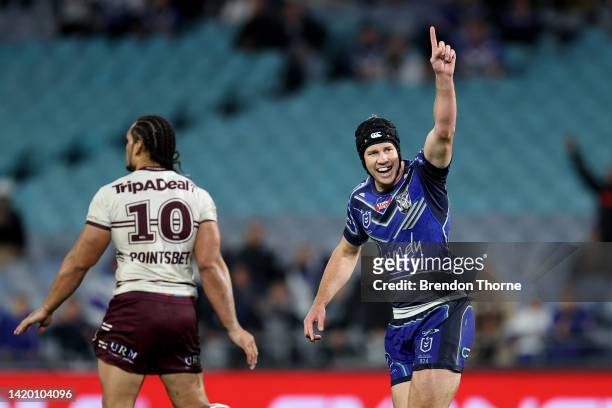 Matt Burton of the Bulldogs kicks a field goal in the final minutes of the game during the round 25 NRL match between the Canterbury Bulldogs and the...