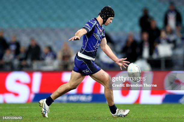 Matt Burton of the Bulldogs kicks a field goal in the final minutes of the game during the round 25 NRL match between the Canterbury Bulldogs and the...