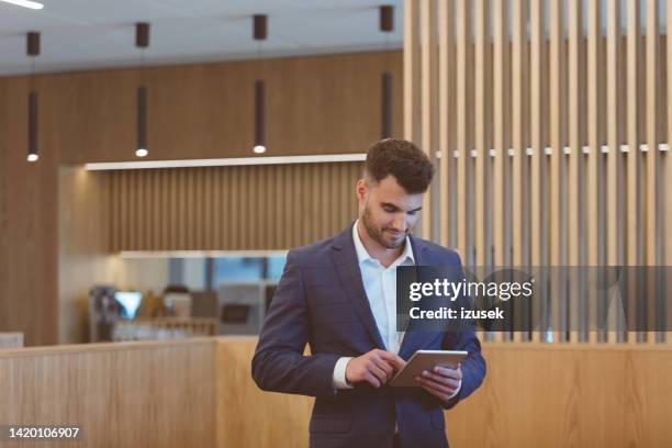 businessman standing  in the aiport vip lounge - star style lounge imagens e fotografias de stock