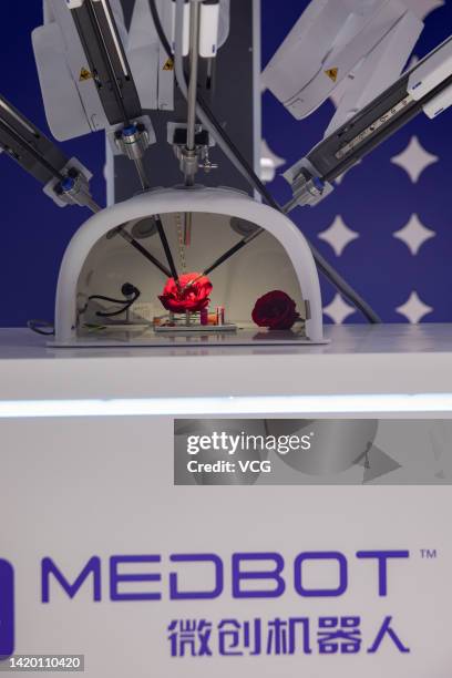 The Toumai Endoscopic Surgery Robot is on display at the booth of Shanghai MicroPort Medical Co., Ltd during the 2022 World Artificial Intelligence...