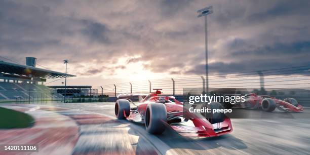 two generic racing cars driving around corner of racetrack at dawn - car racing blurred motion stock pictures, royalty-free photos & images