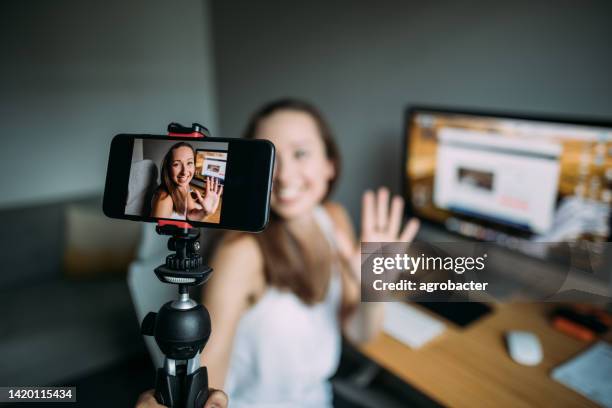 beautiful woman vlogging at home - record stock pictures, royalty-free photos & images