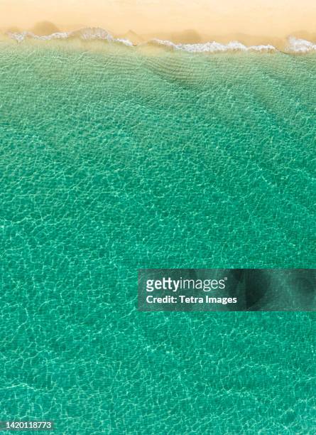 overhead view of turquoise ocean and beach - boca raton stock-fotos und bilder