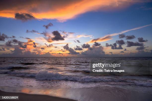 dramatic sunrise sky above ocean and beach - boca-raton stock pictures, royalty-free photos & images