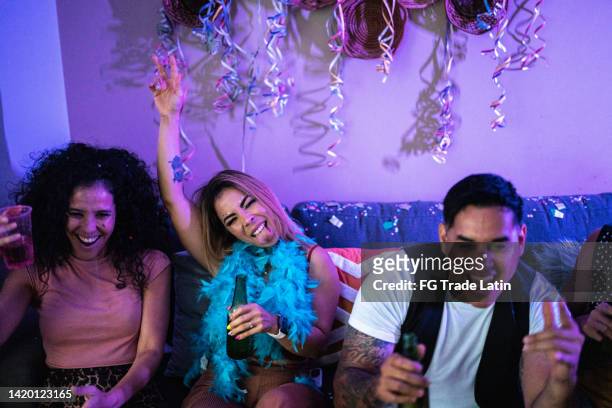 friends celebrating and drinking beer at party - friends tv show stock pictures, royalty-free photos & images