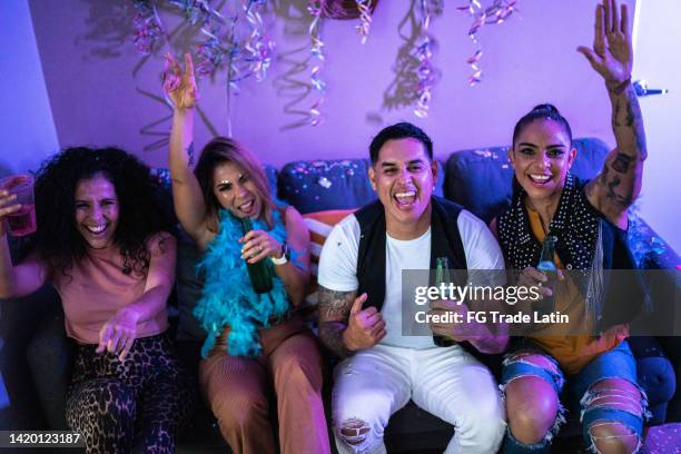 friends celebrating and drinking beer at party - friends tv show stock pictures, royalty-free photos & images