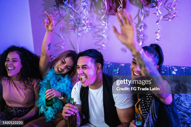 friends celebrating and drinking beer at party - friends tv show stock pictures, royalty-free photos & images