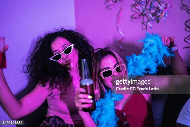 drunk friends having fun at a party - boa stock pictures, royalty-free photos & images