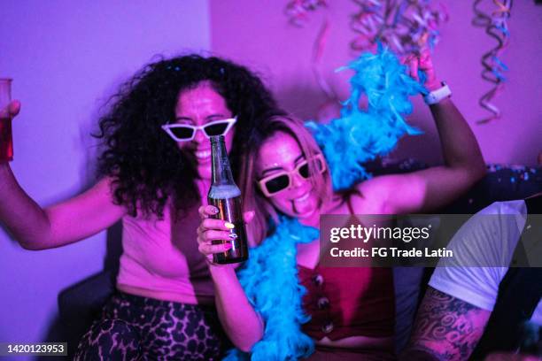 drunk friends having fun at a party - boa stock pictures, royalty-free photos & images