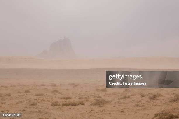 united states, navajo nation, new mexico, dust storm around shiprock - dust storm stock-fotos und bilder