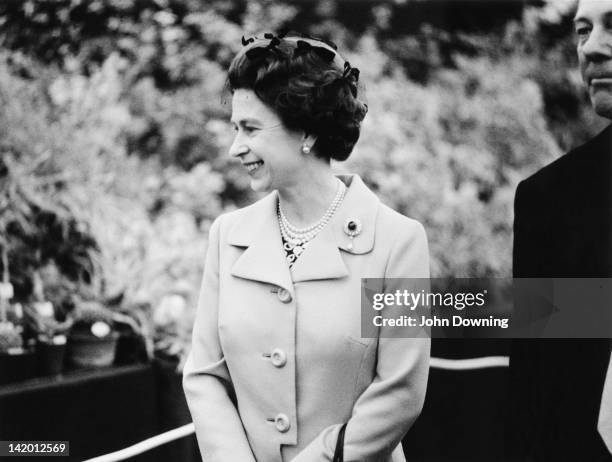 Queen Elizabeth II on a tour of the Chelsea Flower Show, London, 22nd May 1973.