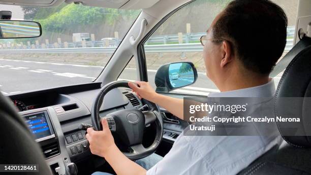 side profile / passengers point of view.  taken on smartphone - side mirror stock pictures, royalty-free photos & images