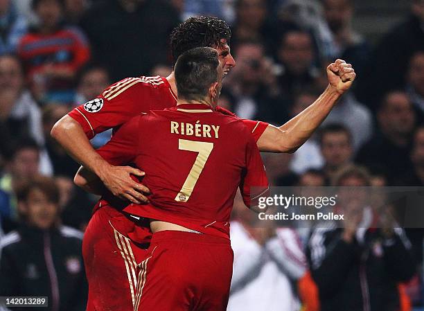 Mario Gomez of Muenchen celebrates with his team mate Franck Ribery after scoring his team's first goal during the UEFA Champions League Quarter...