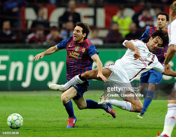 Alessandro Nesta of AC Milan and Lionel Messi of Barcelona compete for the ball during the UEFA Champions League quarter final first leg match...