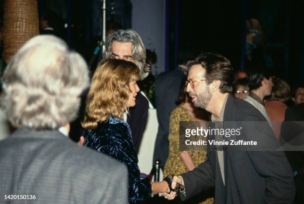 Eric Clapton beside Sam Elliott , Katherine Ross and an unidentified man at the "Rush" Hollywood Premiere held at the General Cinema Hollywood Galaxy...