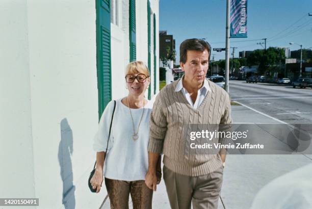 Dick Clark and his wife Kari Clark walking in Los Angeles, California, United States, circa 1990s.