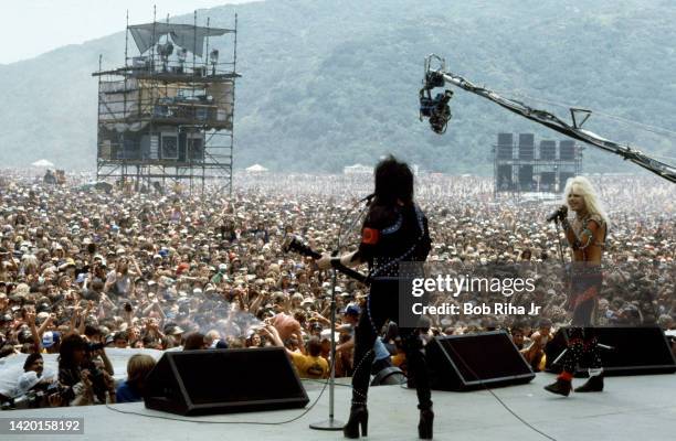 Vince Neil and Mick Mars with Mötley Crüe perform before thousands of rock fans at the US Festival, May 29,1983 in Devore, California.