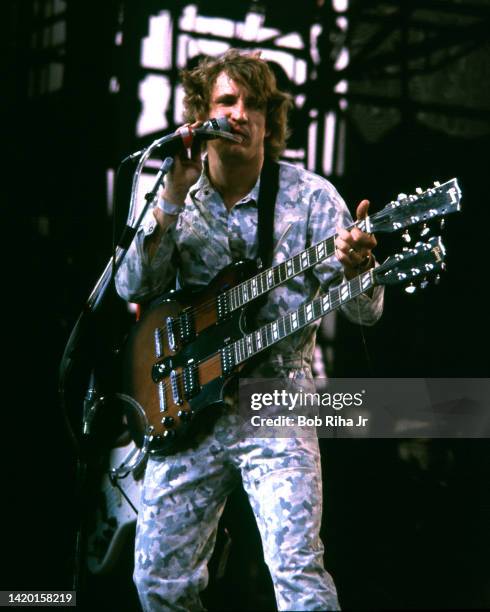 Joe Walsh plays a two-necked guitar as he performs onstage during the US Festival at Glen Helen Regional Park May 30, 1983 in Devore, California.