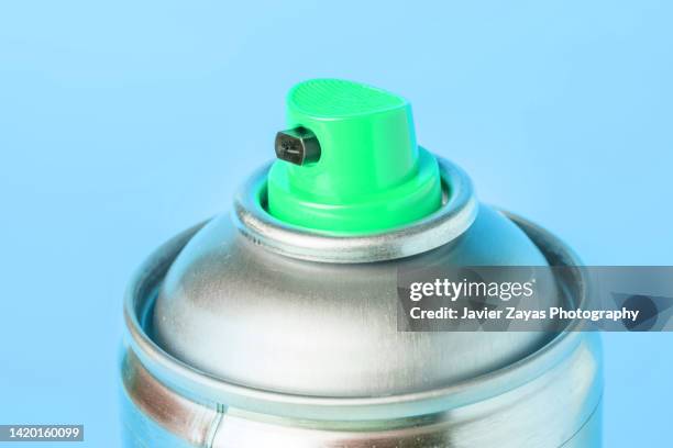 aerosol spray can on blue background - spraydose stock-fotos und bilder