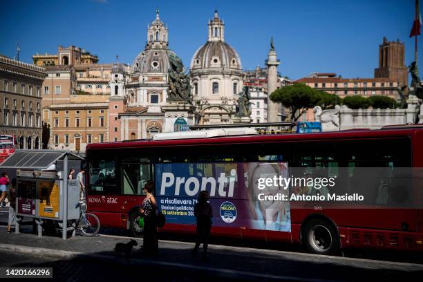 General view shows an election poster showing Giorgia Meloni, leader of Fratelli d’Italia political party, pictured on a public transport bus, on...