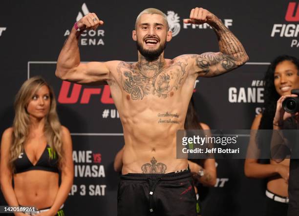 Charles Jourdain of Canada poses on the scale during the UFC Fight Night ceremonial weigh-in at The Accor Arena on September 02, 2022 in Paris,...