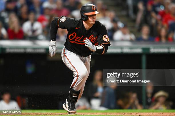 Adley Rutschman of the Baltimore Orioles runs out a ground ball during the eighth inning against the Cleveland Guardians at Progressive Field on...